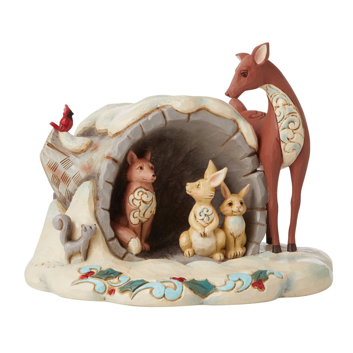 A decorative figurine of woodland animals gathered around a cave opening, including a deer, rabbits, a fox, a bird, and a squirrel, on a snowy base with painted holly and floral details.