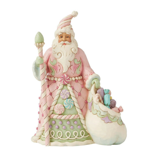 Pastel-colored Santa Claus figurine with candy-themed elements on a white background