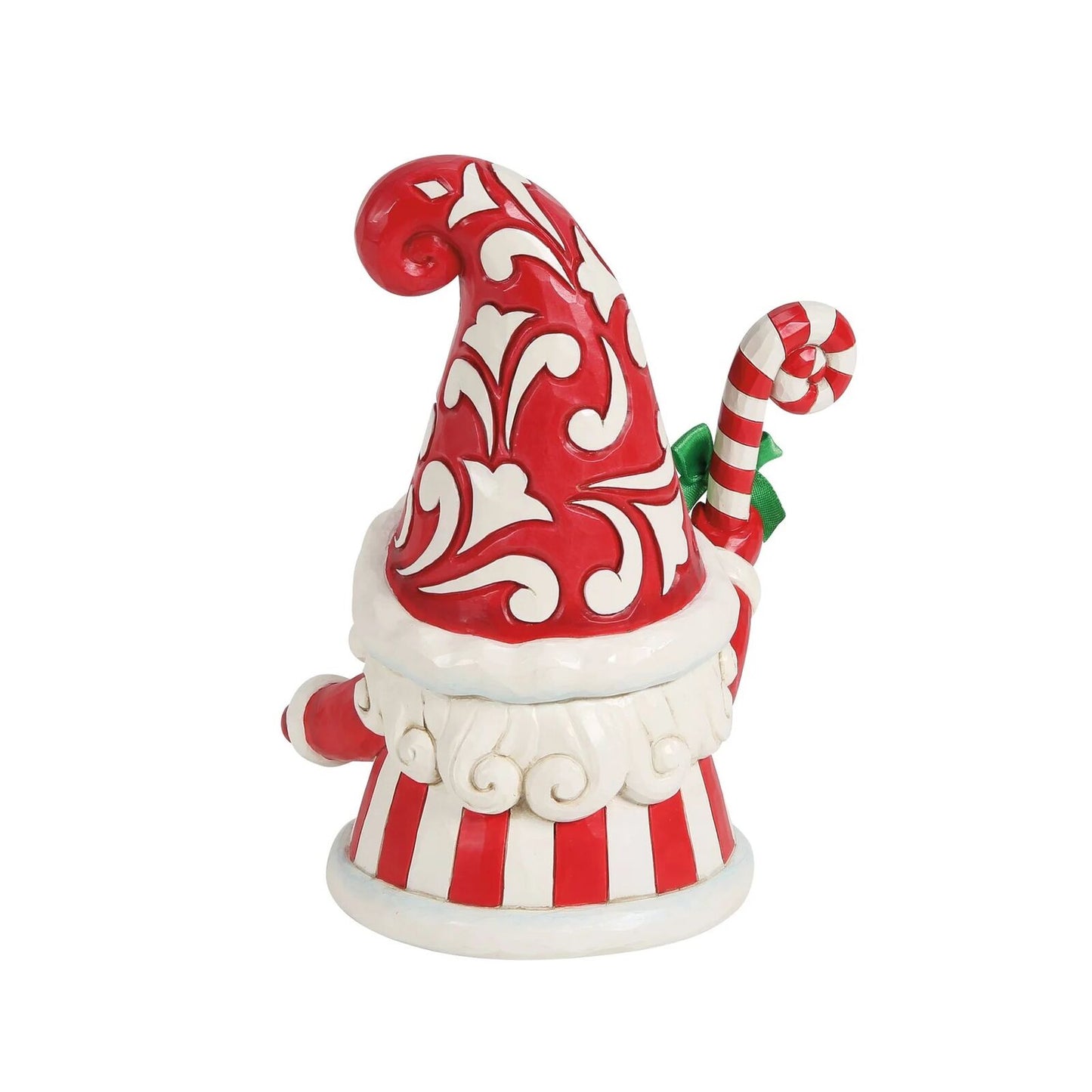 Decorative gnome figurine with red and white hat and striped pants on a white background