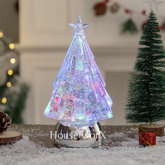 Decorative Christmas tree with colorful lights on a snowy surface, featuring the brand 'Houseworx'. snow globe