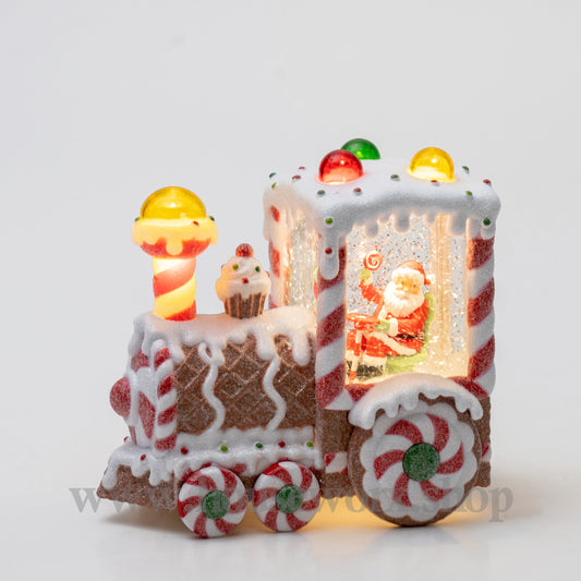 Decorative gingerbread train with candy details on a white background christmas snow globe