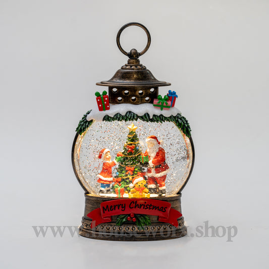 Christmas snow globe with Santa Claus and a tree on a gray background