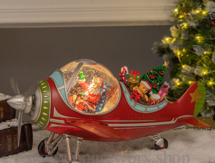 Festive plane snow globe santa