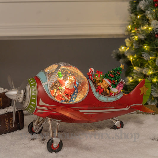 Festive plane snow globe santa