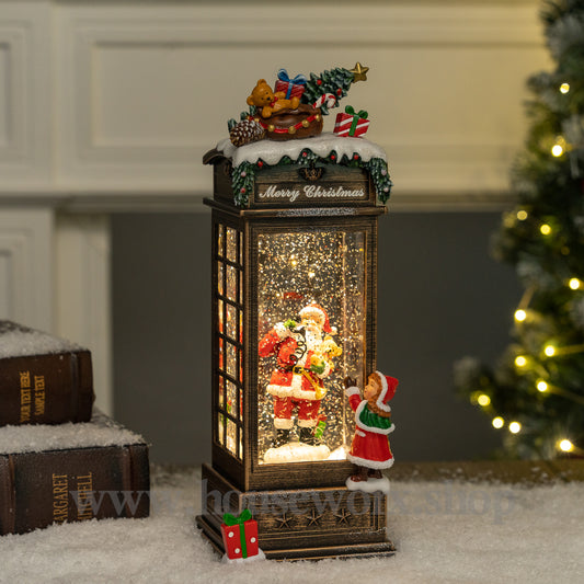 Festive telephone booth santa snow globe