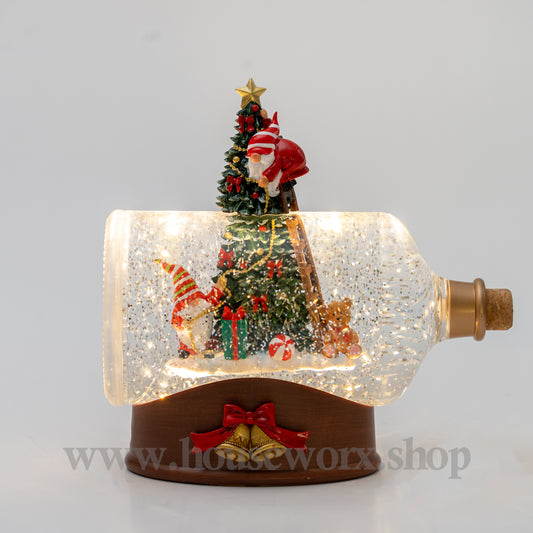 Decorative Christmas scene in a bottle with gnome, trees, and lights on a gray background. christmas snow globe