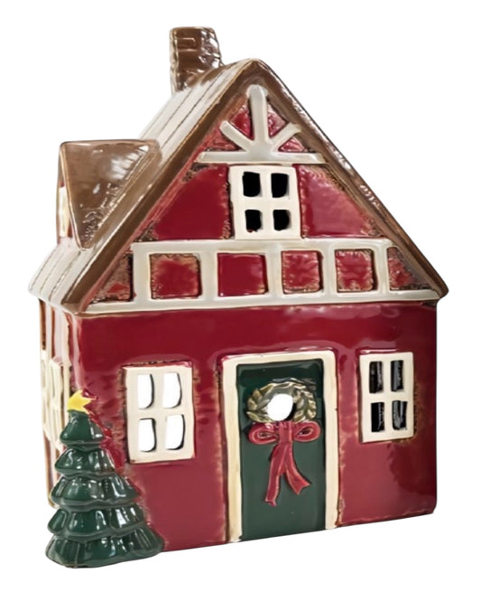 Decorative house ornament with a wreath and small tree on a white background