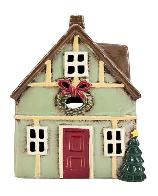 Decorative house ornament with a wreath and doorbell on a white background