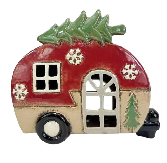 Decorative ceramic camper with Christmas tree and snowflakes on a white background