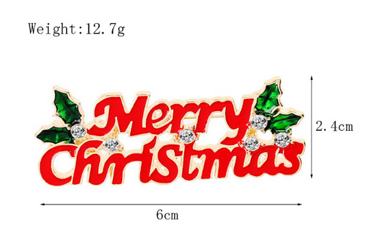 A Merry Christmas themed brooch with red text and green Christmas decorations on a white background, with dimensions labeled as 2.4cm H x 6cm W.