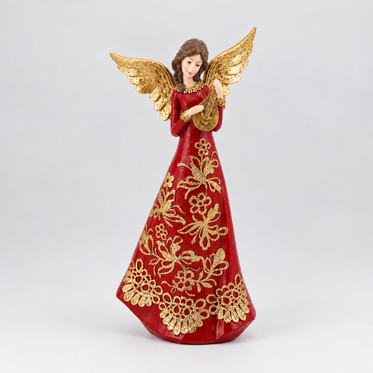 A decorative angel figurine with gold wings and a red gown decorated with gold floral patterns, standing against a light gray background.