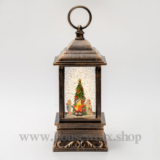 Decorative lantern with a Christmas scene inside on a white background 360 degree rotating children around tree christmas snw globe