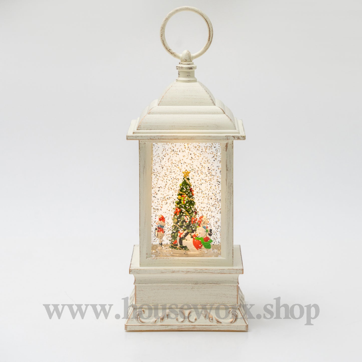 Decorative lantern with a Christmas scene inside on a white background 360 degree rotatng snowman christmas snow globe