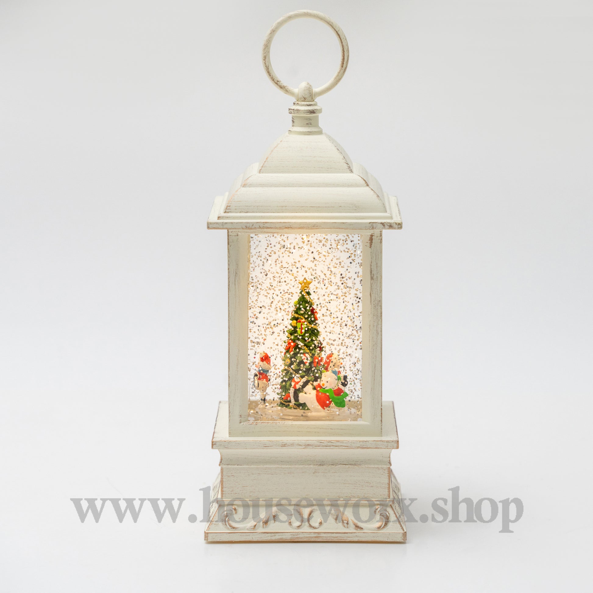 Decorative lantern with a Christmas scene inside on a white background 360 degree rotatng snowman christmas snow globe