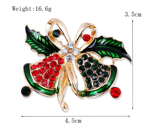 A red and green Christmas-themed brooch with a golden bow and red berries, measuring 3.5cm in height and 4.5cm in width.