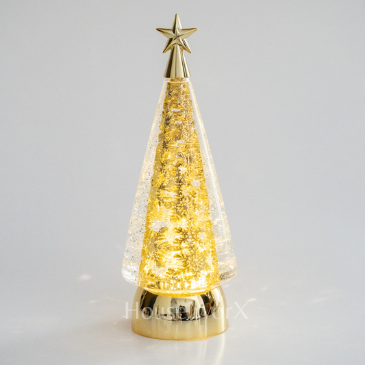 Decorative Christmas tree lamp with gold star on a gray background snow globe