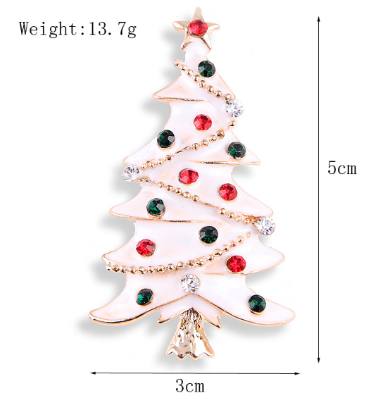 A white Christmas tree-shaped brooch adorned with red and green gemstones and silver accents, with dimensions of 5cm in height and 3cm in width.