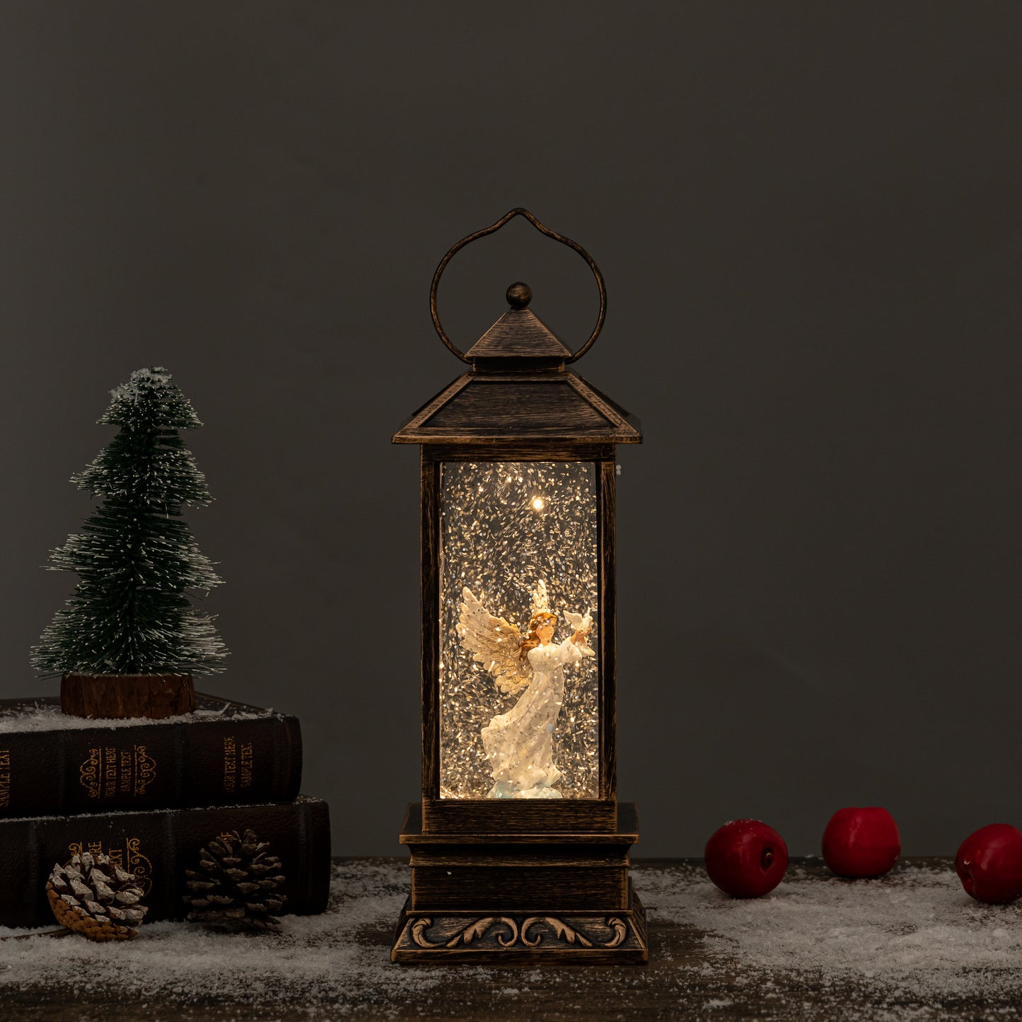 Angel and dove snow globes front view