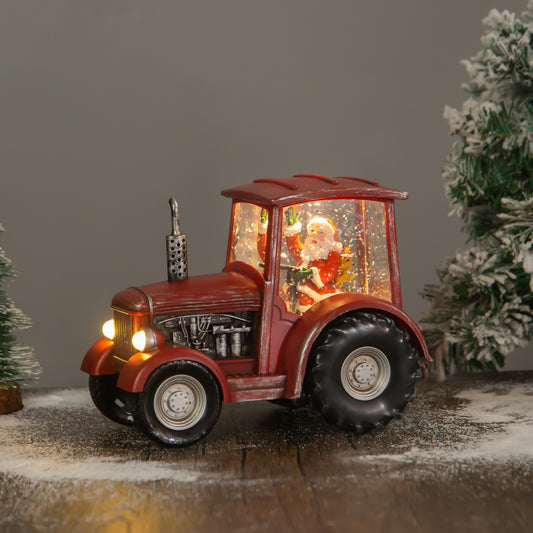 red tractor christmas snow globe