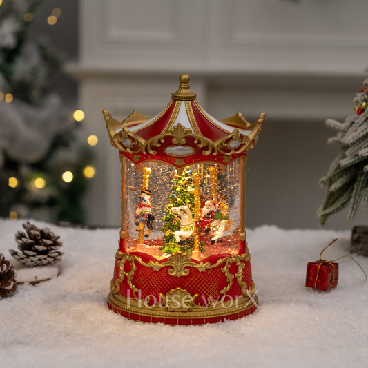 Decorative Christmas Snow Globe carousel with lights on a snowy surface, featuring 'House of Worx' branding.