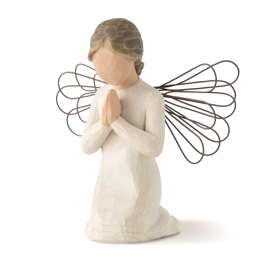 Angel figurine with wire wings on a white background