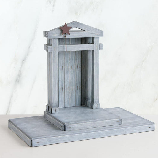 Gray wooden birdhouse with a star on a white background