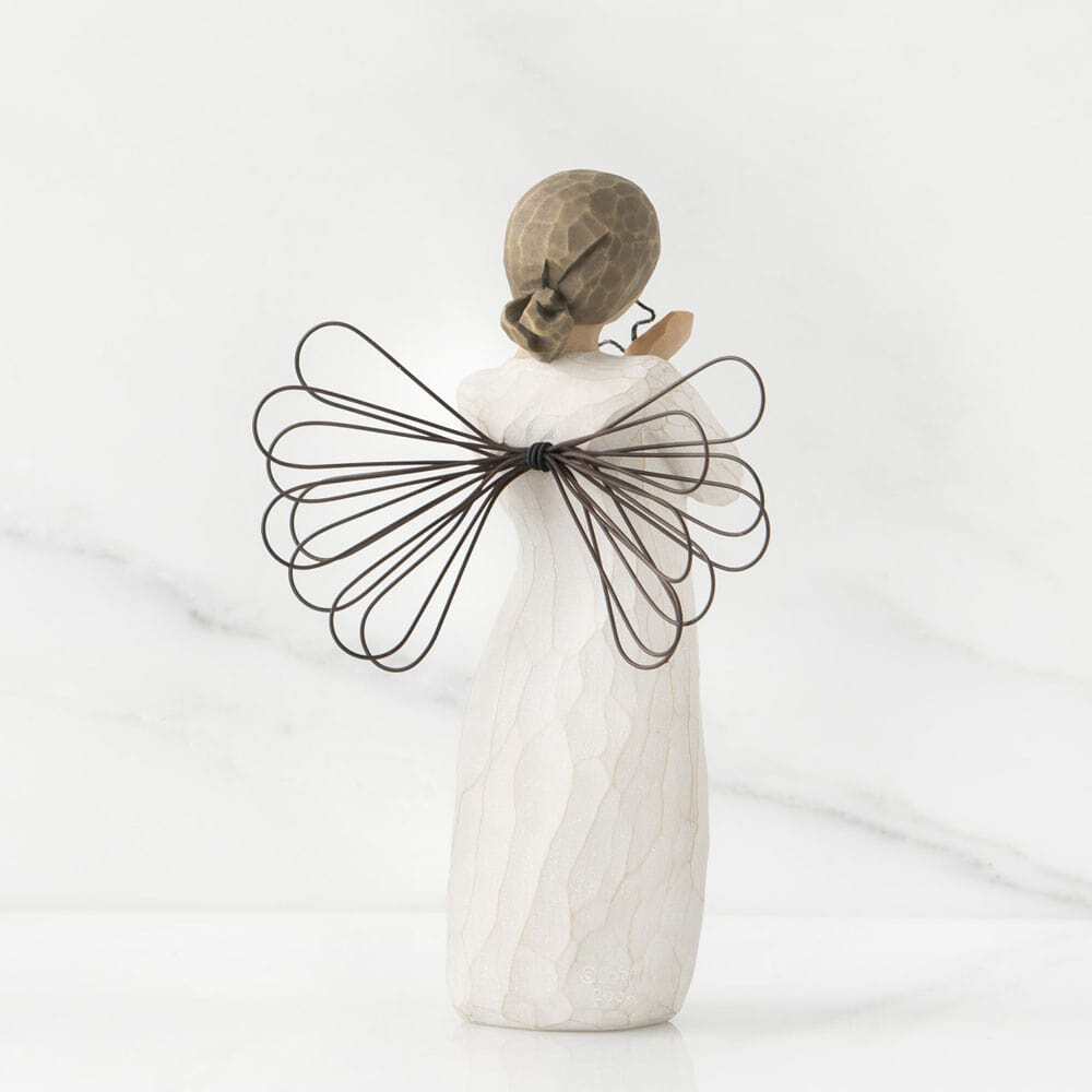 Decorative angel figure with wire wings on a white background