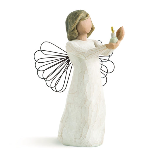 Angel figurine with outstretched wings holding a light bulb on a white background