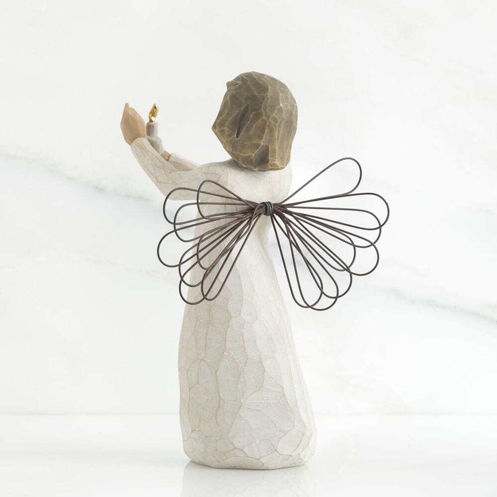 Decorative angel figurine with wire wings on a white background