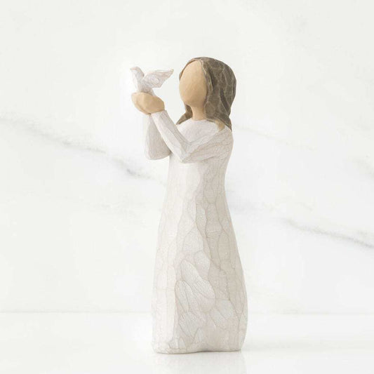 Statue of a woman holding a rabbit on a white background