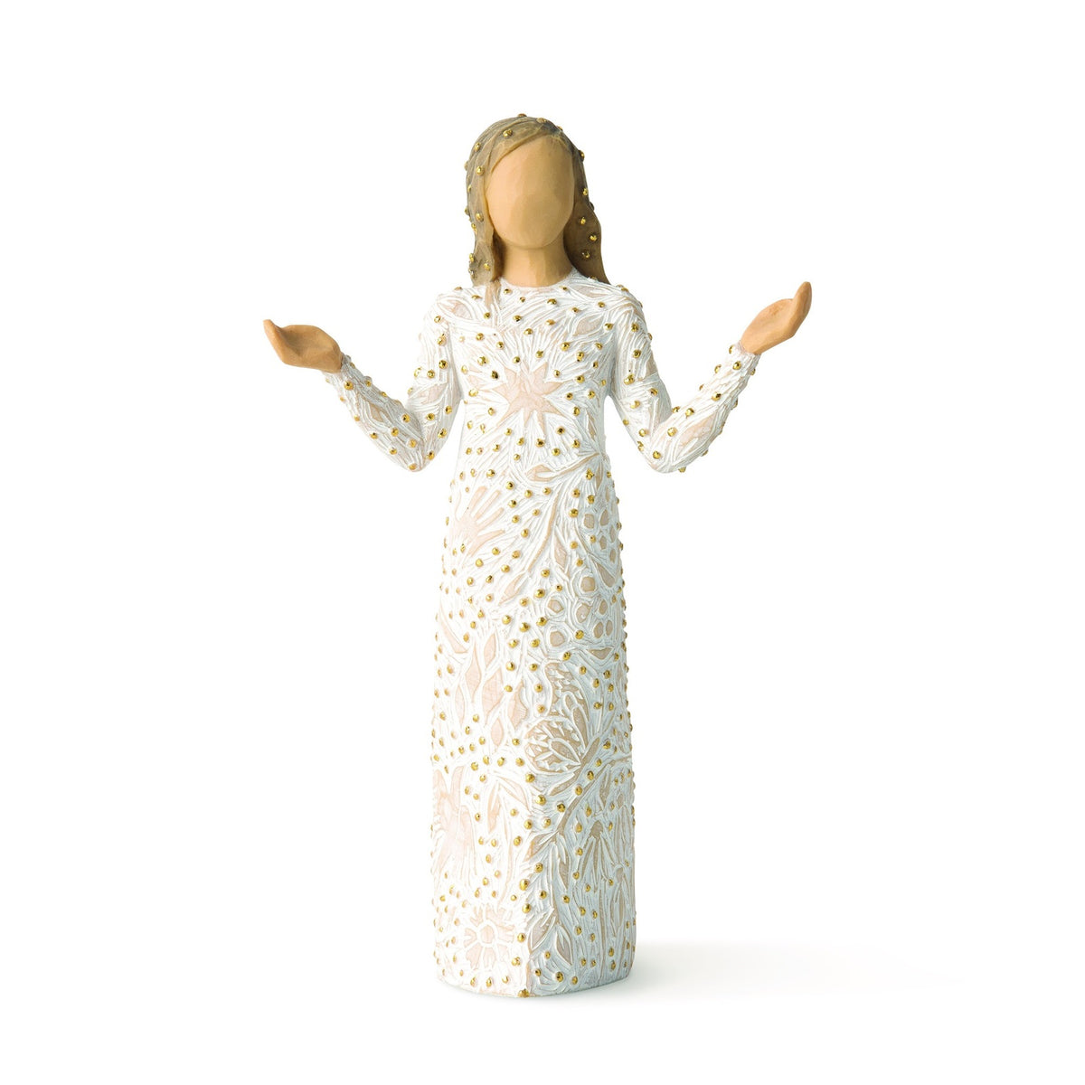 Figurine of a woman in a white dress with gold patterns on a white background