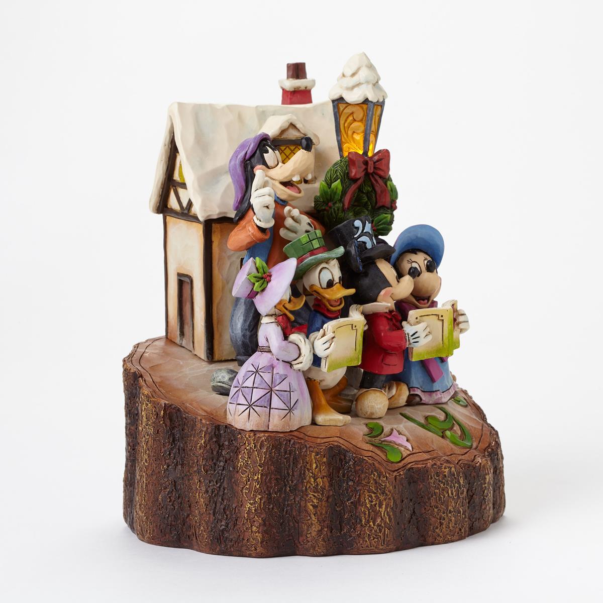 Animated character figurine with a house and books on a white background