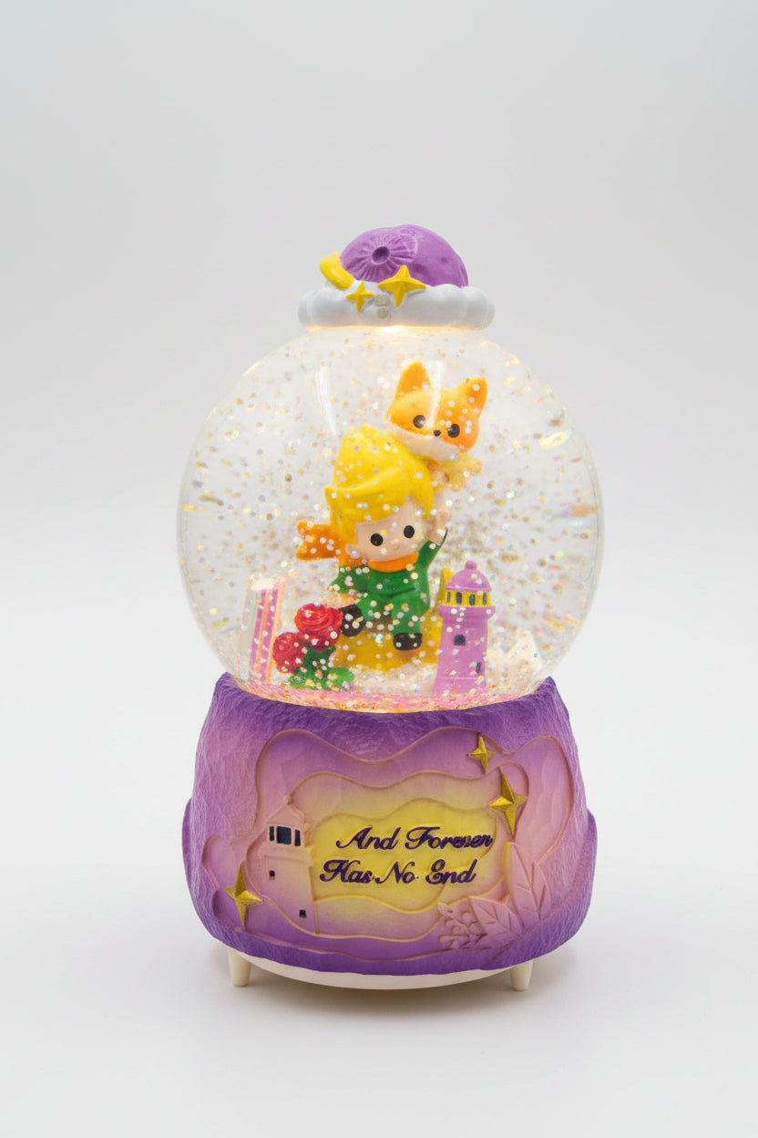 A purple and gold fairy-themed snow globe music box with a glowing interior, featuring a character in a green dress, a fox, and the phrase 'And Forever Has No End' on the base, shown on a kitchen countertop.