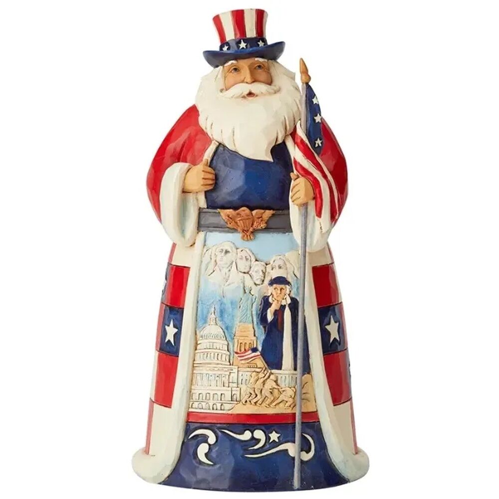 A decorative figurine of Uncle Sam dressed as Santa Claus, wearing a red, white, and blue outfit with an American flag and holding a sword, set against a plain white background.