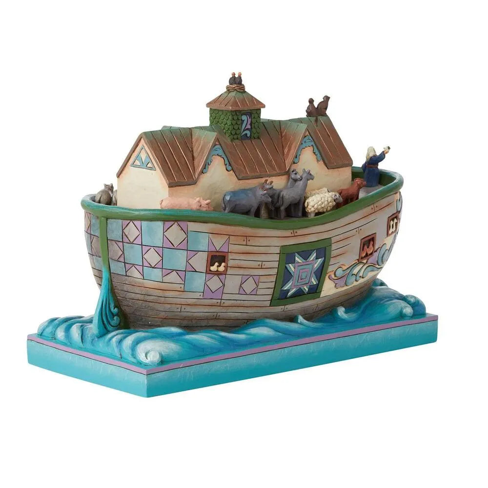 Decorative model of Noah's Ark with animals on a white background