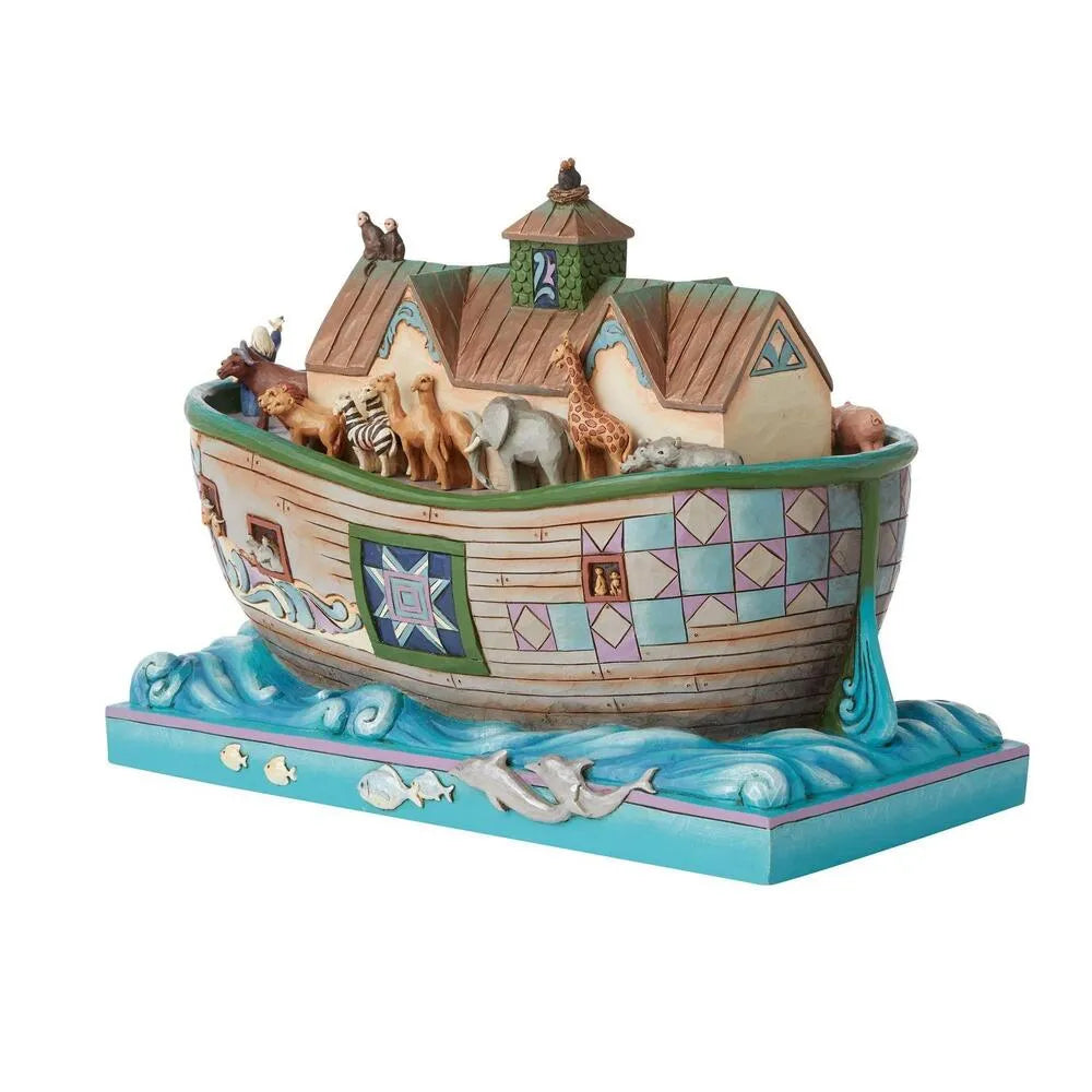 Decorative model of Noah's Ark with animals on a white background