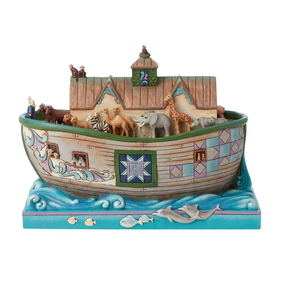 Decorative model of Noah's Ark with animals on a white background