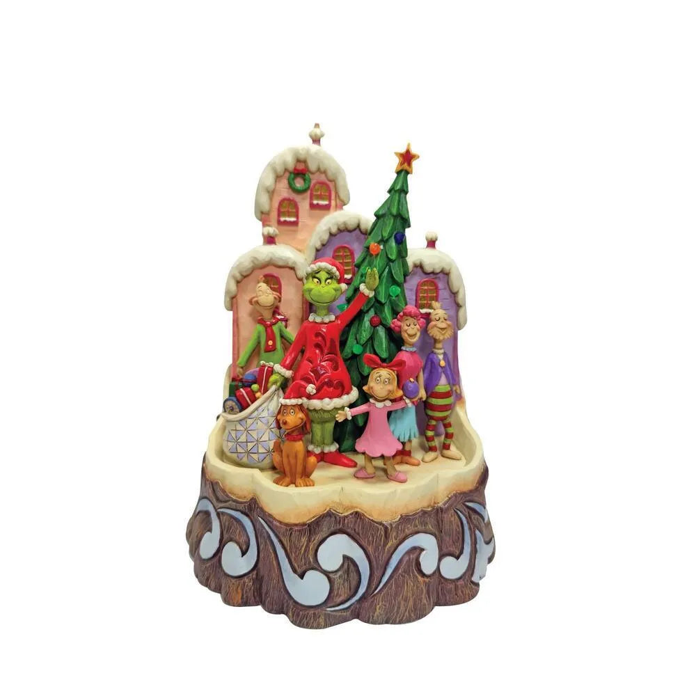A Grinch-themed Christmas figurine set on a log-shaped base, featuring the Grinch, Cindy Louder, the Grinch Kids, a dog, and a Christmas tree with candy, against a plain white background.