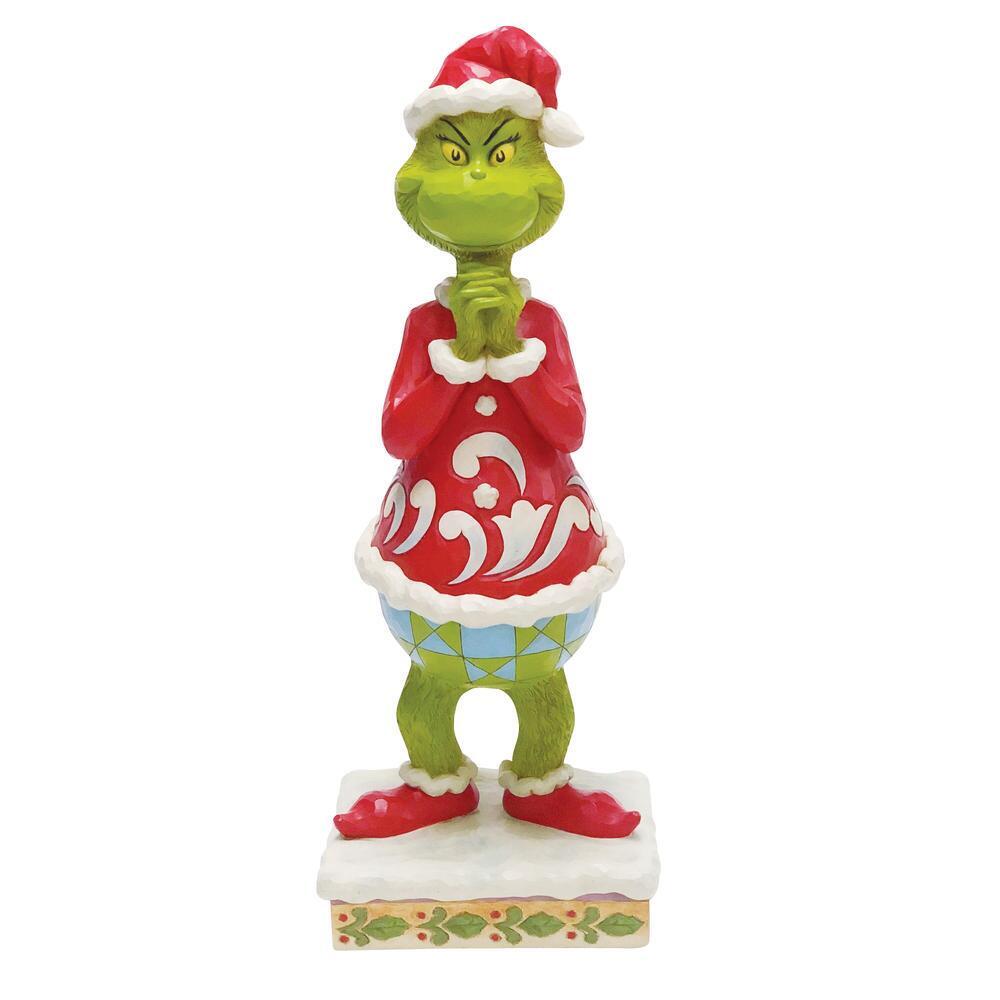 Green character in a red outfit with white trim on a white background