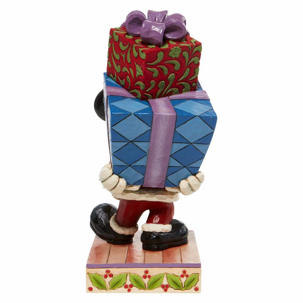Figurine of a character holding two large presents on a white background