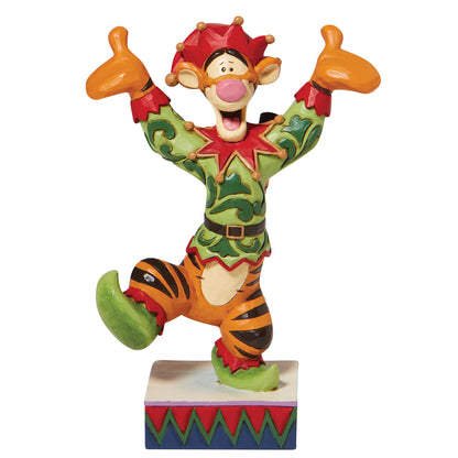 Colorful figurine of a cartoon tiger with a crown on a white background