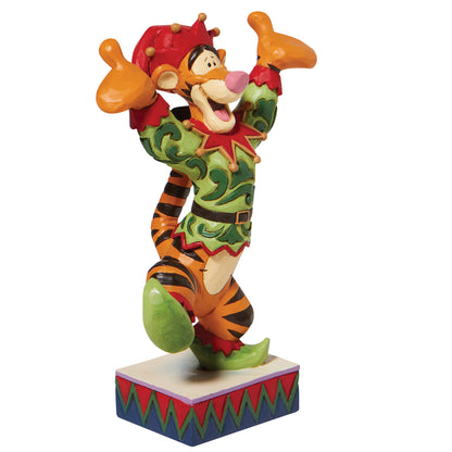 A decorative figurine of Tigger dressed as an elf, standing on a patterned base against a plain white background.