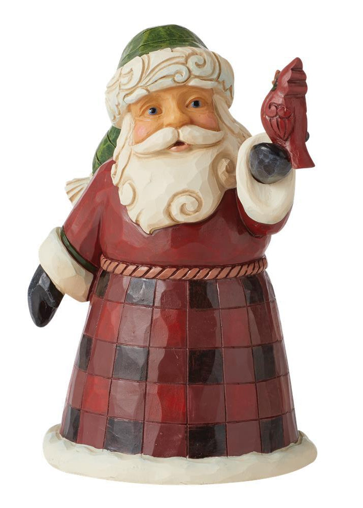 Decorative figurine of a Santa Claus holding a fish on a white background