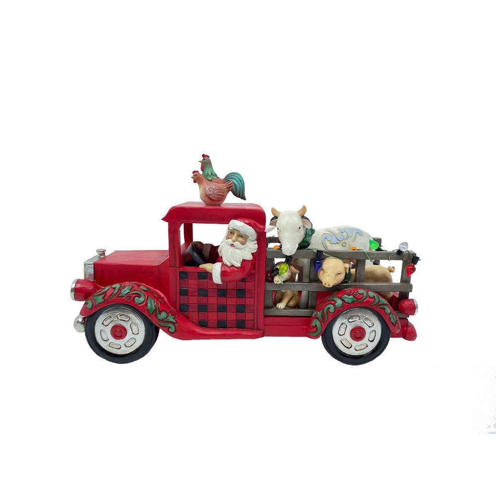 Decorative Christmas truck with Santa Claus and animals on a white background