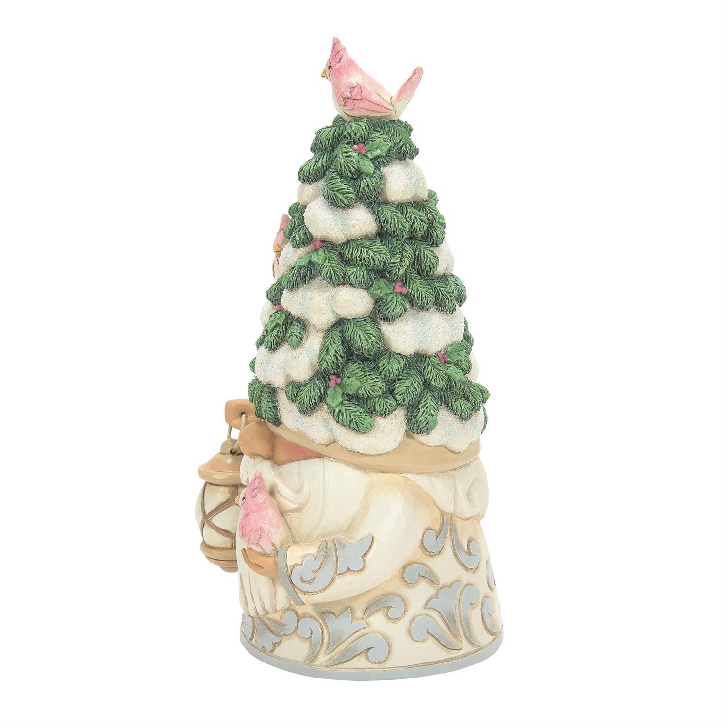 A decorative Christmas gnome figurine wearing a green pine tree hat with white faux snow, holding a lantern, on a plain white background.