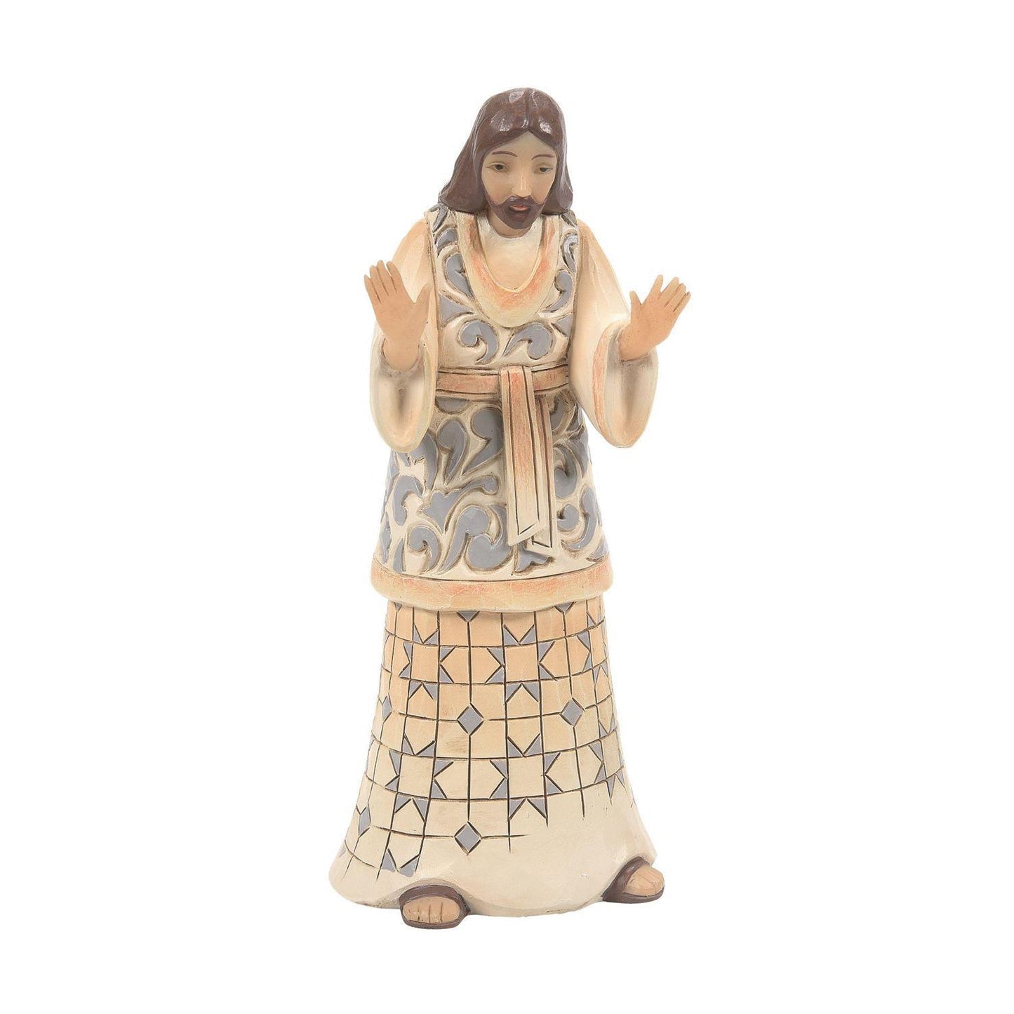 A hand-painted ceramic figurine of Jesus Christ with hands raised in a gesture of teaching or blessing, set against a plain white background.