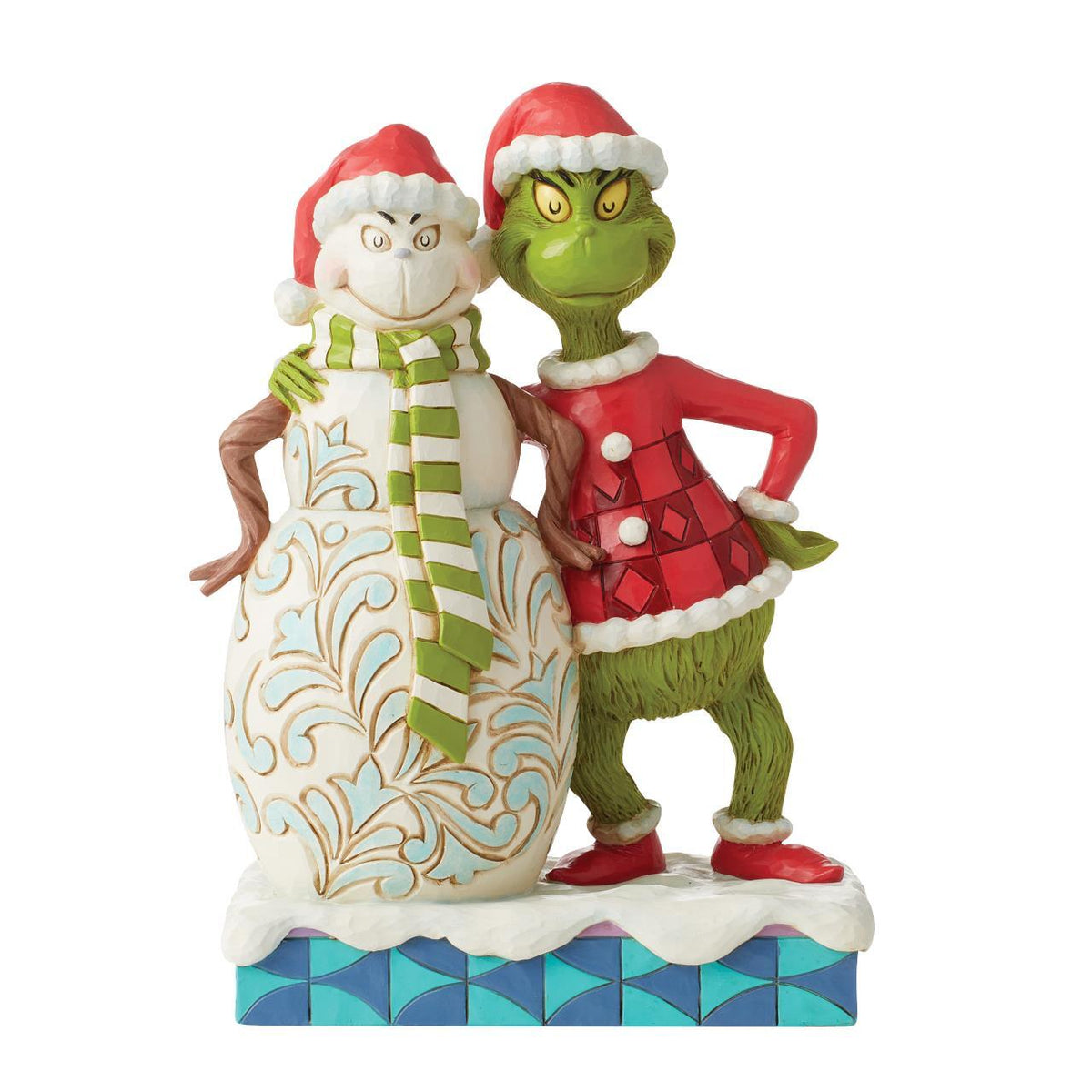 Grinch standing next to snowman