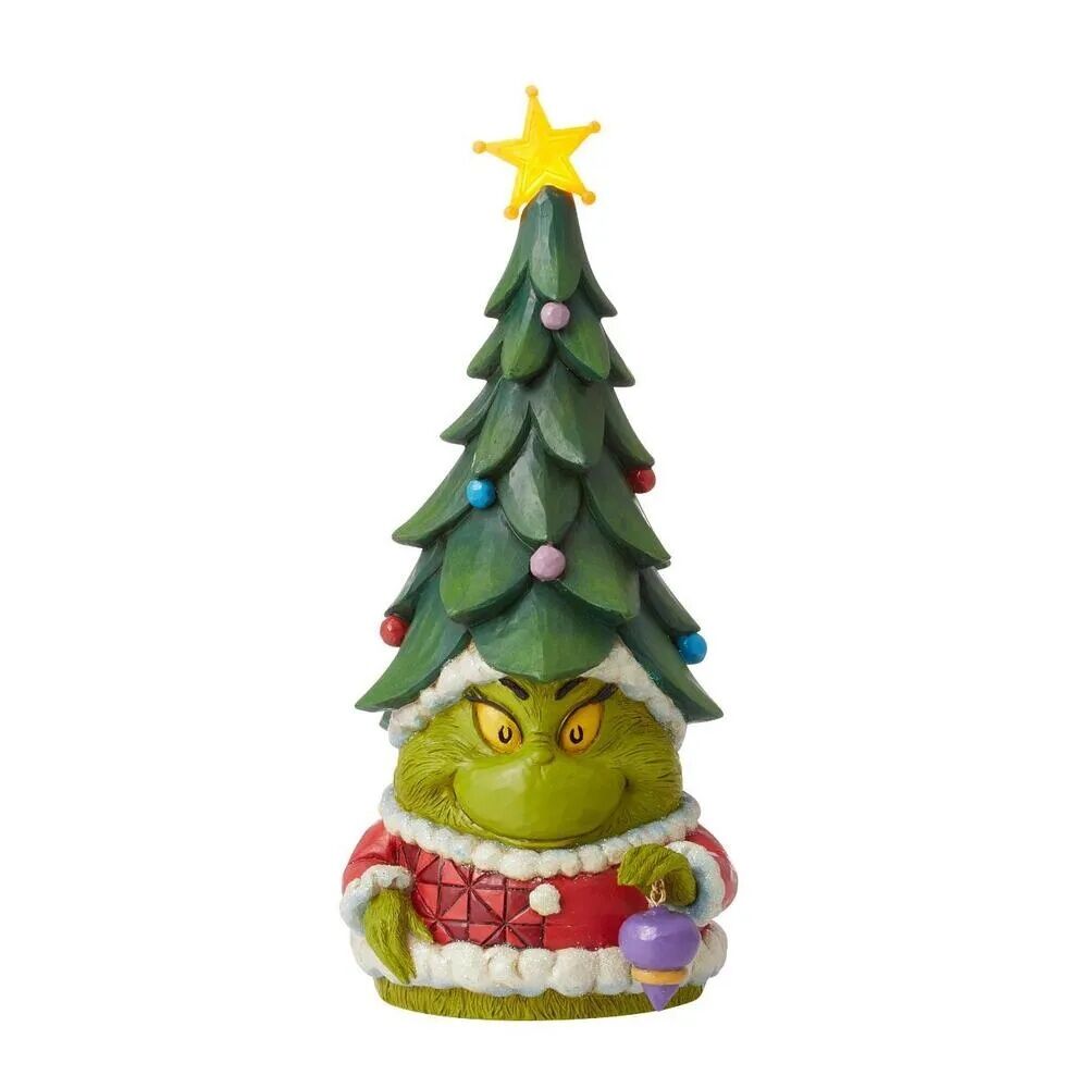 Figurine of a character with a Christmas tree on its head, holding a purple ornament.