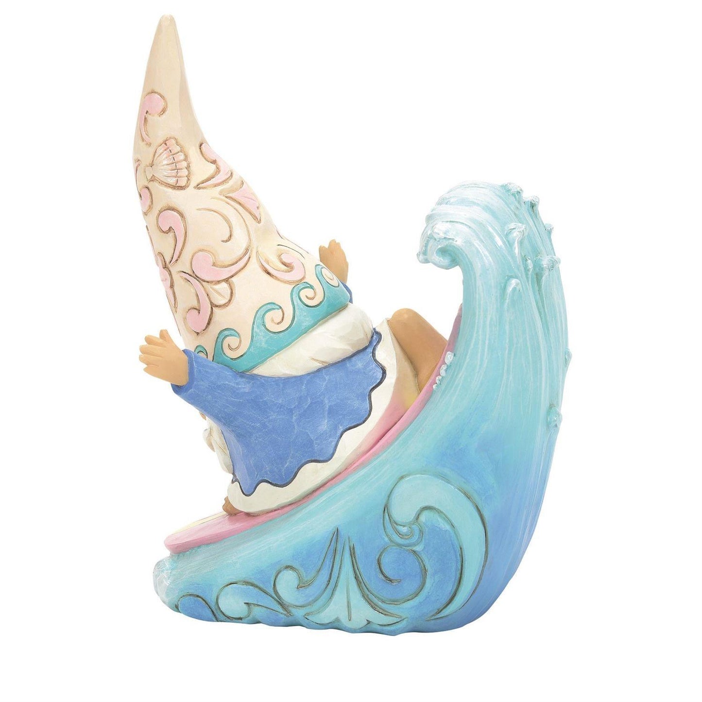 A decorative garden gnome figurine sitting on a stylized blue wave, with a tall cream-colored hat decorated with pink swirls and shell motifs, a blue outfit, and tan skin tones.