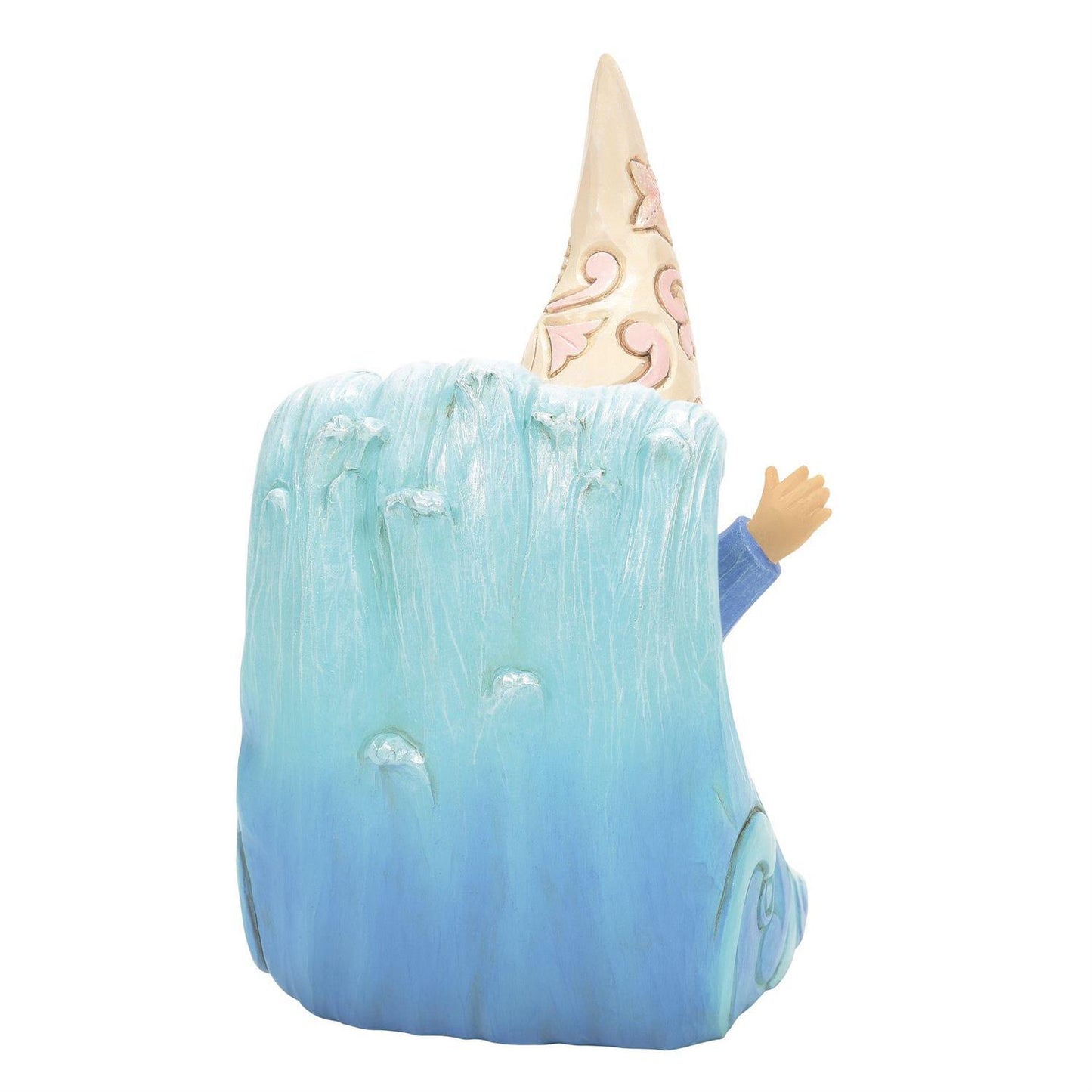 A whimsical garden gnome figurine emerging from a large blue wave-like base, with a tall cream-colored pointed hat decorated with pink swirls and a small tan hand visible on the right side.